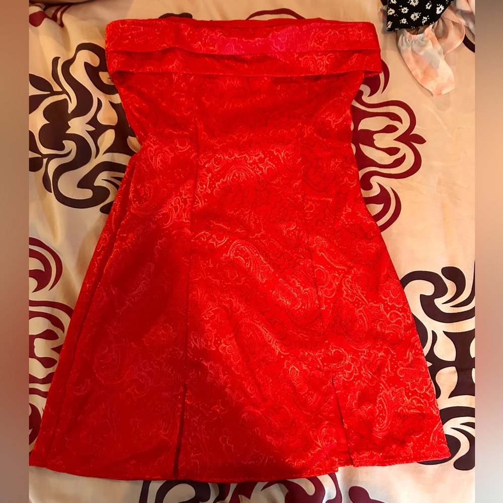 This is a mini orange party dress.
